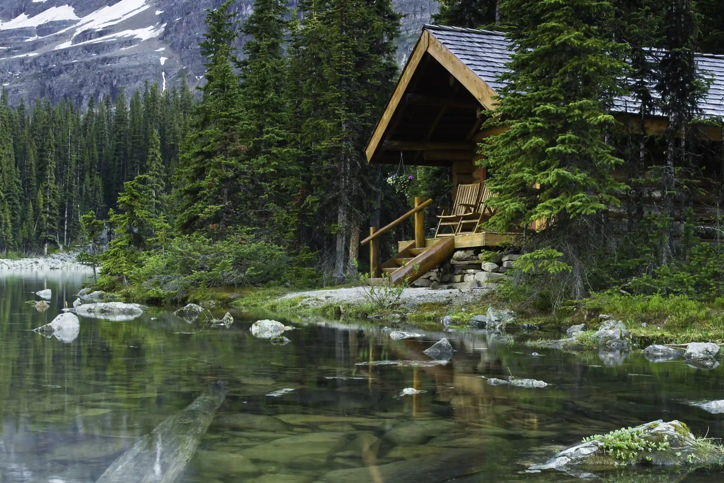 Rustic cabin on the lake in the forest.