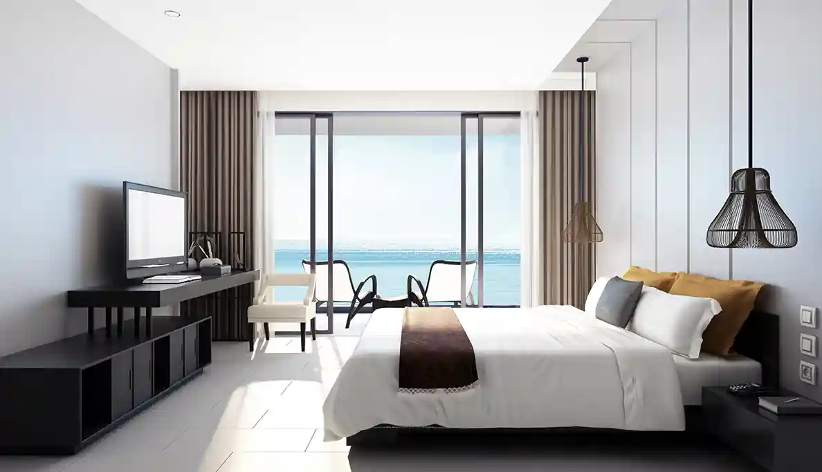 A tidy hotel room overlooking the ocean