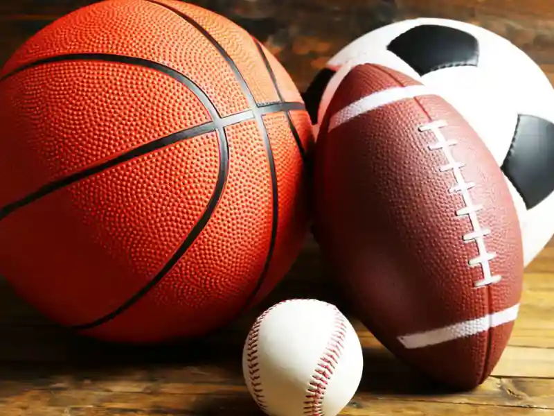 close up of a basketball, football, baseball and soccer ball