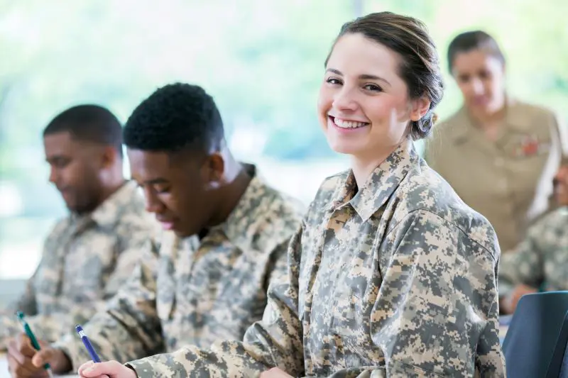 Soldiers sitting and writing