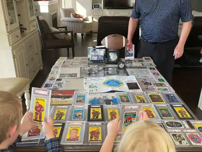 Sports cards, autographs and other memorabilia on a table.