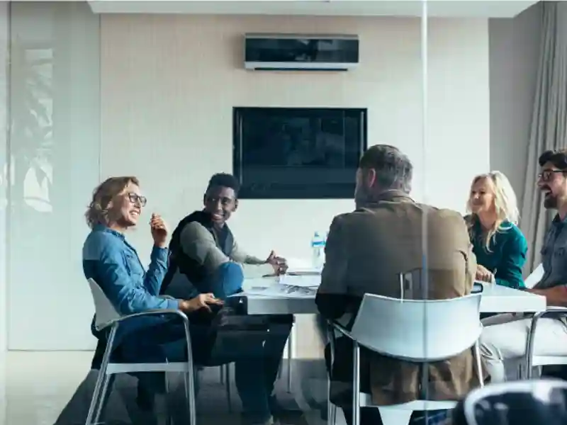 People having a discussion in a conference room