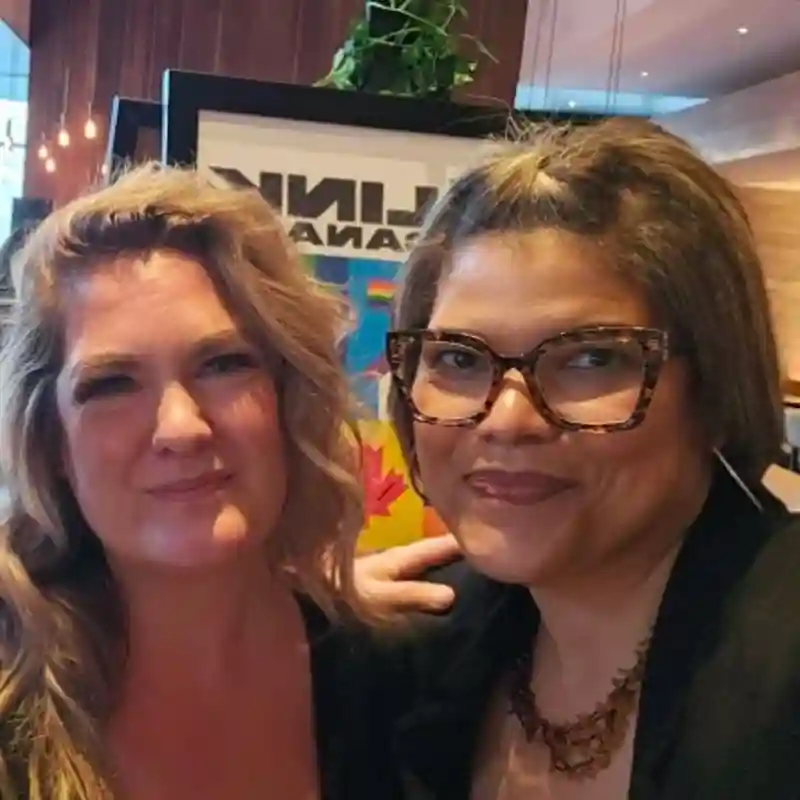 Two NFP employees smiling.