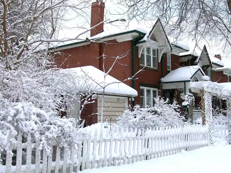 House covered by winter snow after blizzard in Toronto, Canada.
