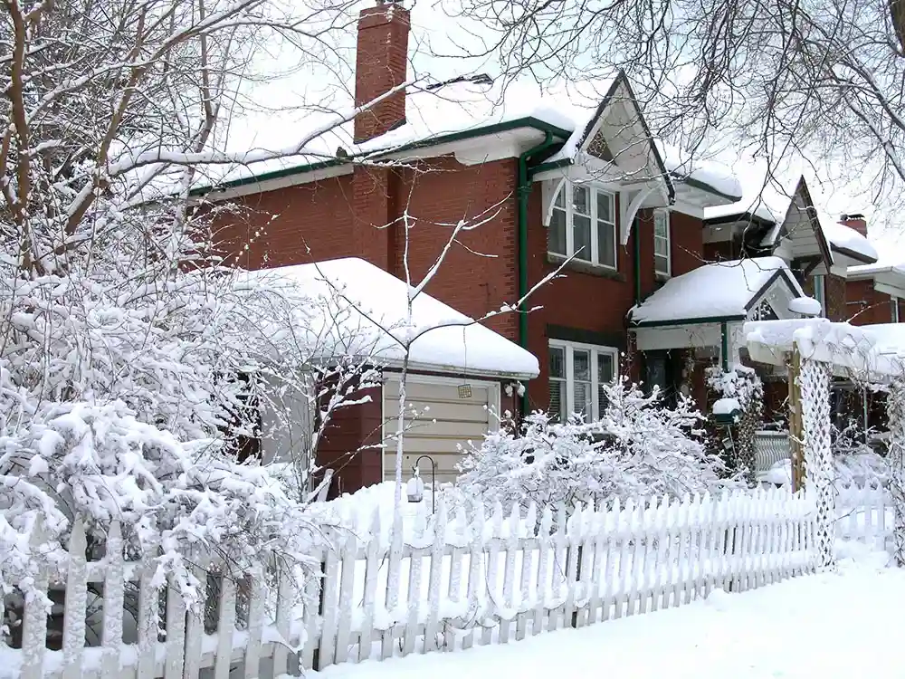 House covered by winter snow after blizzard in Toronto, Canada.