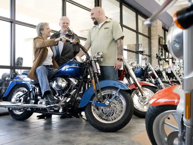Older couple shopping for motorcycles.