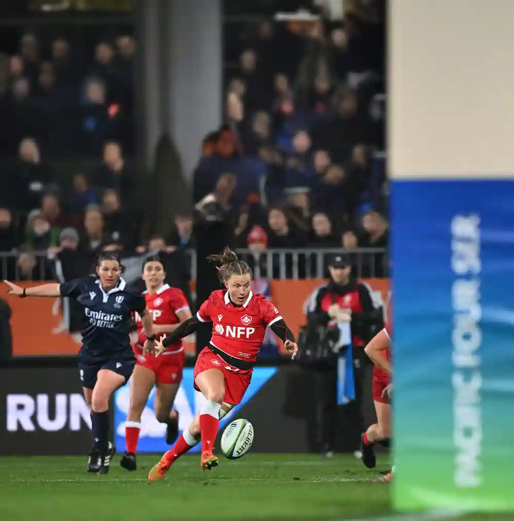 Action shot of the Canadian women's rugby team.