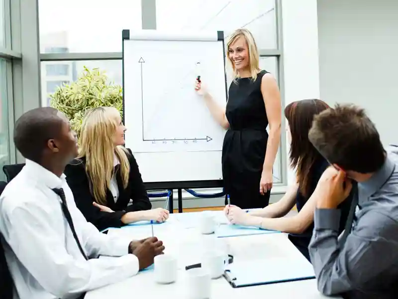 Attractive businesswoman giving a presentation to her team